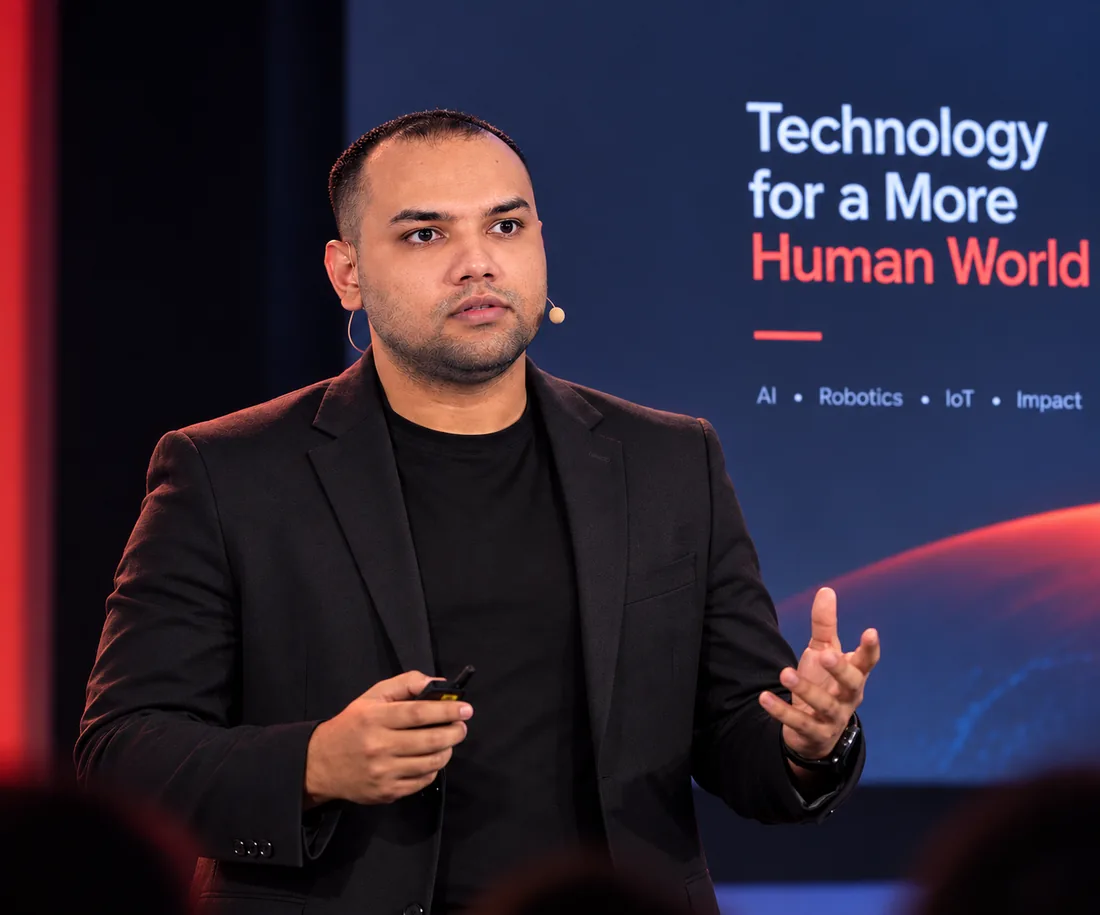 Sadman Sakib Saumik presenting on stage at a technology conference